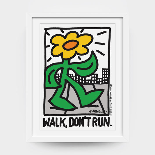 A framed art print with a graphic design of a sunflower and text 'WALK, DON'T RUN.' City art.